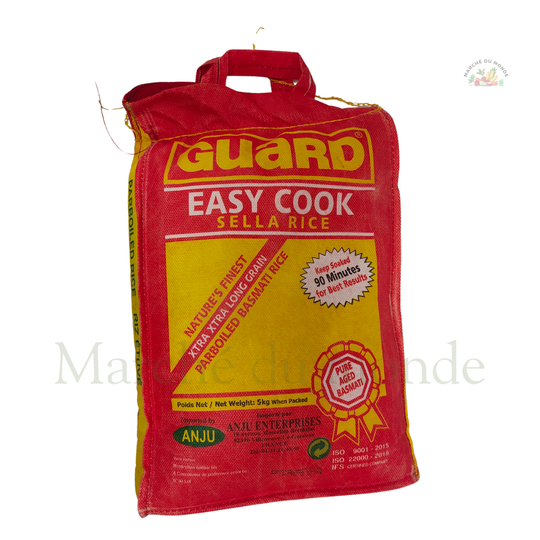 Grand sac rouge et jaune de riz Guard Easy Cook Sella Rice. Le texte indique "EASY COOK SELLA RICE", "NATURE'S FINEST XTRA XTRA LONG GRAIN PARBOILED BASMATI RICE" et "Soak 30 Minutes For Best Results".